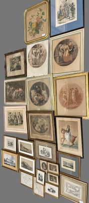 many framed pictures on the wall of this room