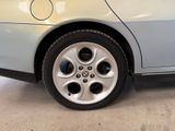 a close up of a car ' s tire on the ground