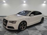 an image of a white audi car in a showroom