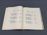 an open book with a list on it on a table