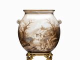 a vase that has a picture of a castle on it
