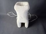 a small white object with a cord attached to it