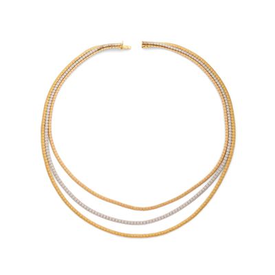 un collier en or et en argent orné de trois rangées de diamants