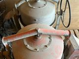 two large pots sitting on top of a wooden table