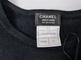 a close up of a black shirt with a tag on it