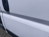 a close up of the side of a white truck