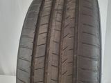 a close up of a tire on a white surface