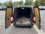 a van that is parked in a parking lot with its doors open