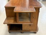 a wooden cabinet with a glass door on top of it