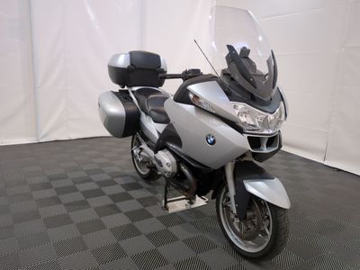 a motorcycle that is parked on a black and white checkered floor