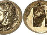 a silver coin with an image of a woman ' s head on it