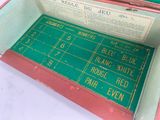 a box that has a green and red mat inside of it