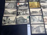 several old black and white photographs of buildings and buildings on a table