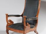 an image of a wooden chair with a blue upholstered seat