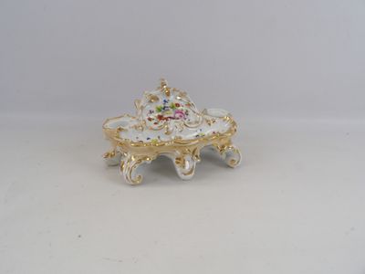 an image of a white and gold plate with flowers on it