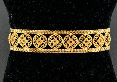 Bracelet articulé et ajouré en or jaune 750 millièmes orné d…