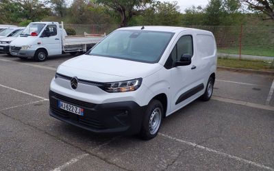 a white van that is parked in a parking lot