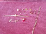 a lot of jewelry that is laying out on the table