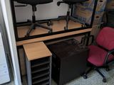 a desk with a chair and a computer on top of it