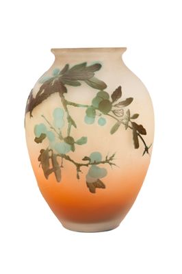 a vase that has a dragonfly design on it