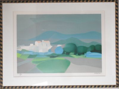 tableau encadré représentant un paysage avec un château au loin