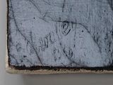 a close up of a piece of wood with writing on it