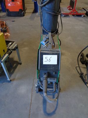 a machine that is sitting on the floor in the garage