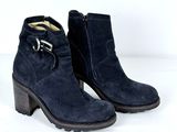 navy blue sued ankle boots with buckles and a wooden heel