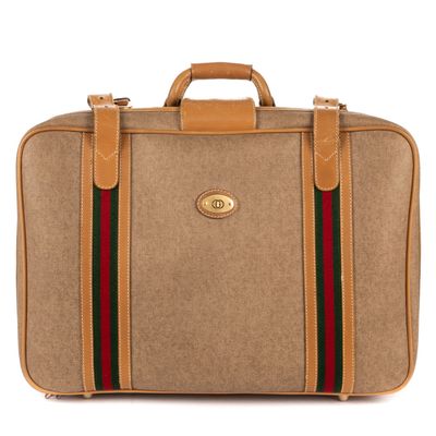 an image of a brown briefcase with a red and green stripe on the side