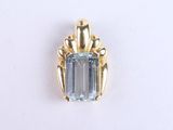 an image of a pendant with a blue stone in the center