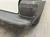 a close up of a car with a sticker on it ' s bumper