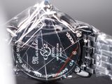 a close up of a watch on a table