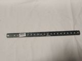an old ruler is laying on a piece of paper on a table