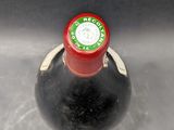 a bottle of wine that is sitting on a table