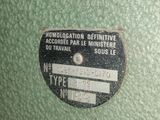 a close up of a metal box with a label on it