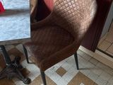 two chairs and a table in the corner of a room
