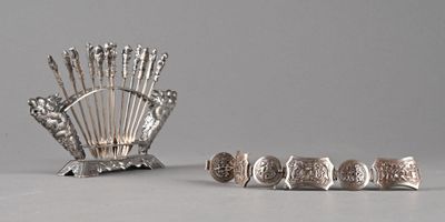 a silver plate with a bunch of metal objects on it