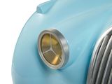 a close up of a car ' s front grill with a clock on it