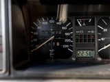 a close up of a car dashboard with a clock on it