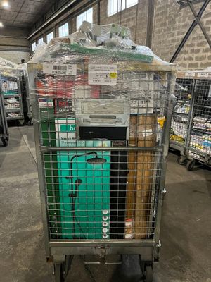 a cart that has a lot of items on top of it
