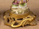 three figurines that are sitting on top of a table