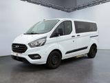 the white van is parked in a large room