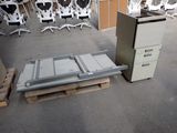 a refrigerator and a filing cabinet in the middle of a room