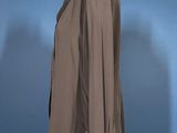 grey jacket on a mannequin stand against a blue wall