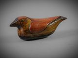 an image of a wooden bird sitting on top of a table