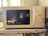 a white microwave oven sitting on top of a counter