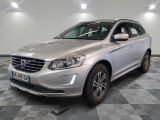 the silver volvo suv is parked in a large room