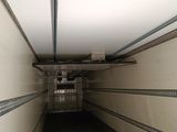 an image of a long narrow hallway with a cage on the ceiling