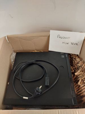 a box with a laptop in it and a sign on it