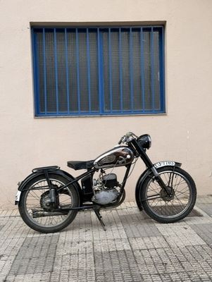 a black motorcycle parked on the side of the street